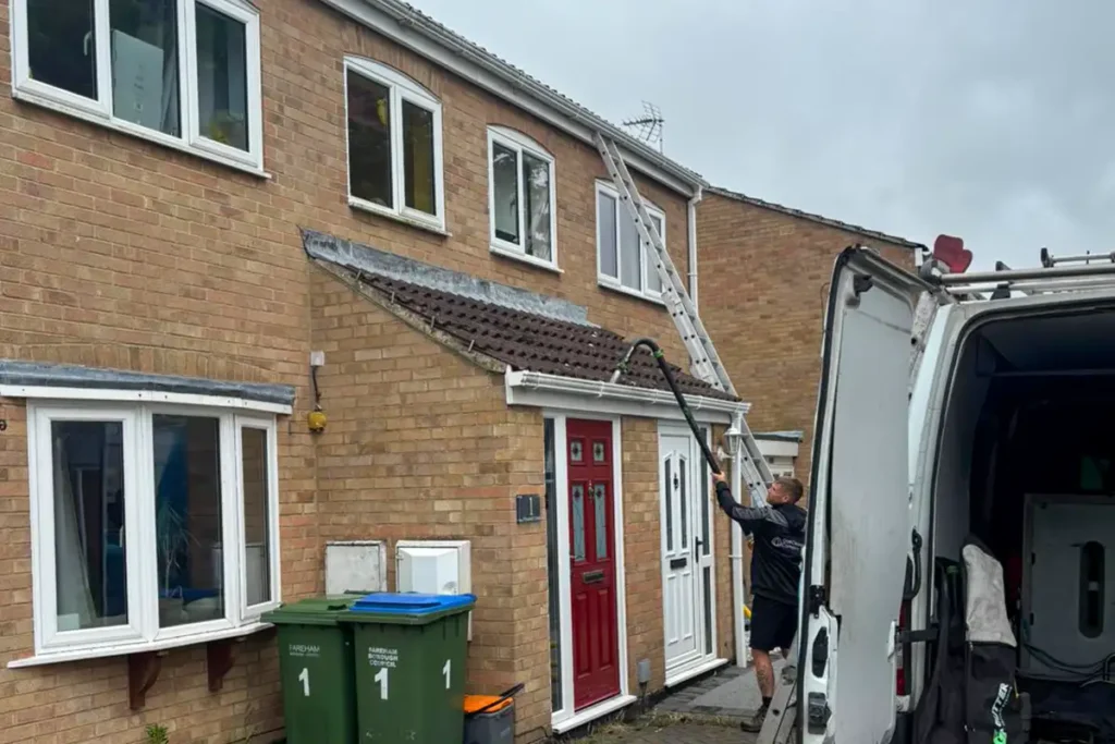 Residential Window Cleaning Fareham Gutter clearance being carried out at a joint residential property in Fareham using a high-reach vacuum system